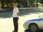 Одетый по форме и с жезлом в руке